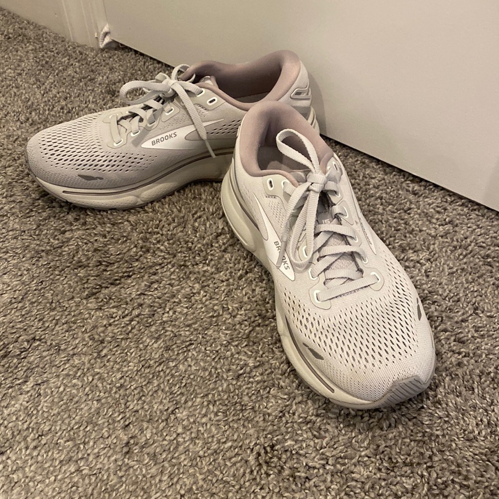 Light grey Brooks tennis shoes